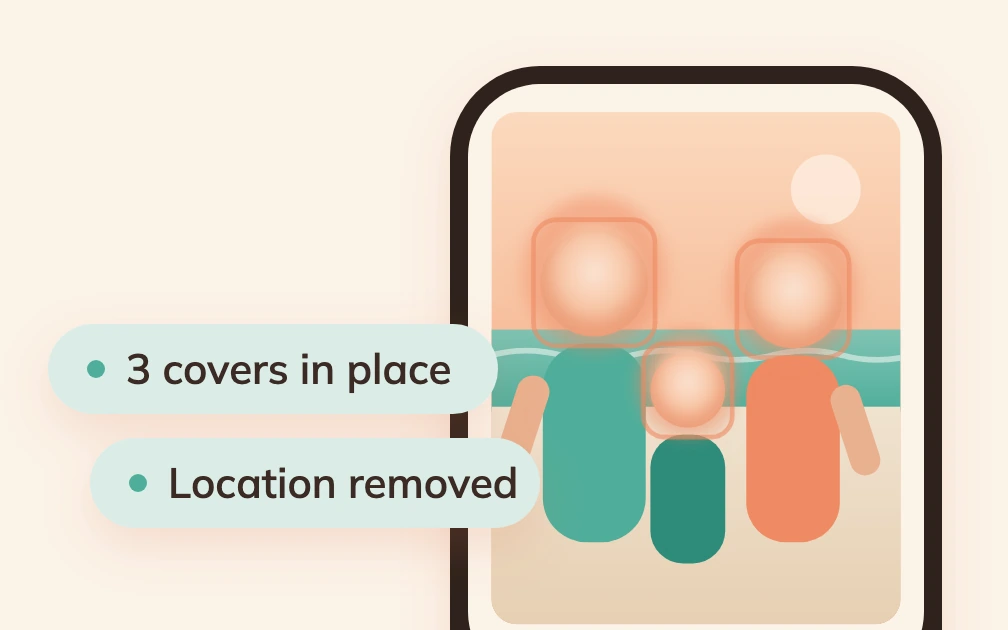 A phone showing a beach photo of a family of three drawn as simple shapes, every face hidden under a soft warm glow inside a coral outline, with the chips 3 covers in place and Location removed floating beside it.